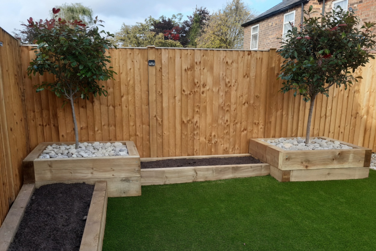 Sleeper-built raised planters with white cobble dressing and ornamental trees