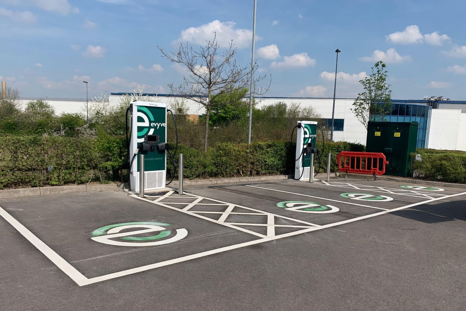 EV charging station bay with green car symbol